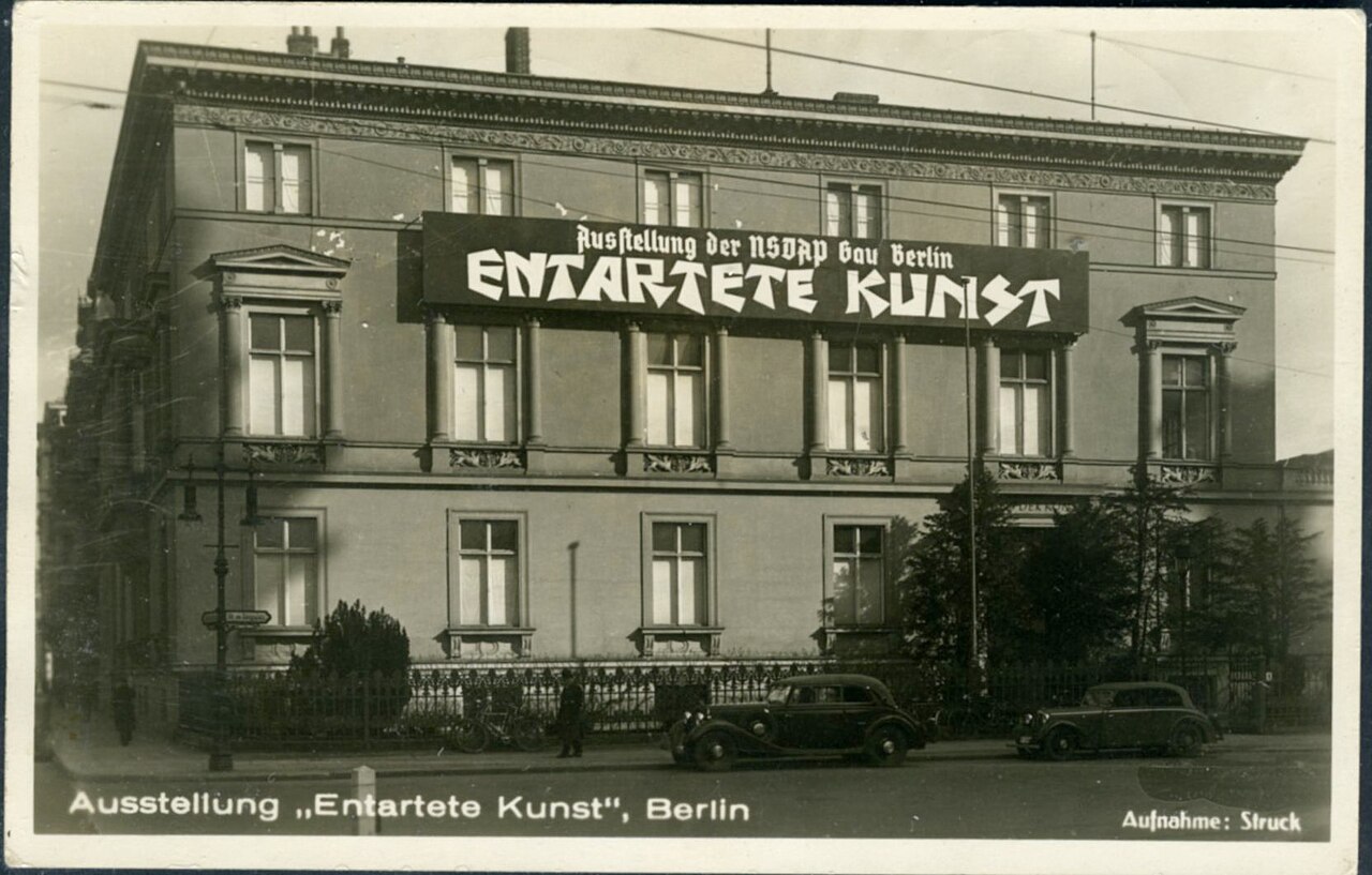 Photograph of the building hosting the 'Degenerate Art' exhibition in Berlin, with a large sign reading Entartete Kunst above the entrance.